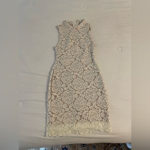 The perfect bridal dress with the dreamiest back! Size M.